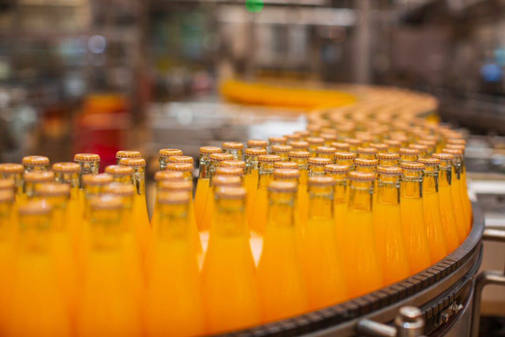 Bottles moving along a conveyor belt.